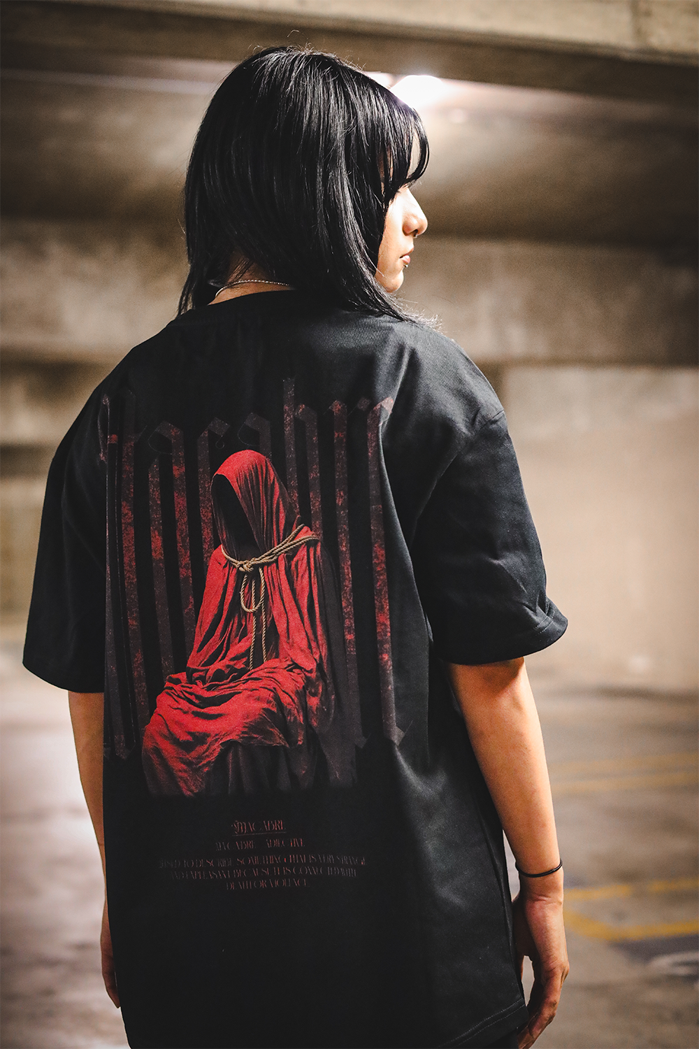 TRGDY black oversized Macabre tee, rear view, heavyweight baggy t-shirt depicting unsettling macabre design, dark streetwear
