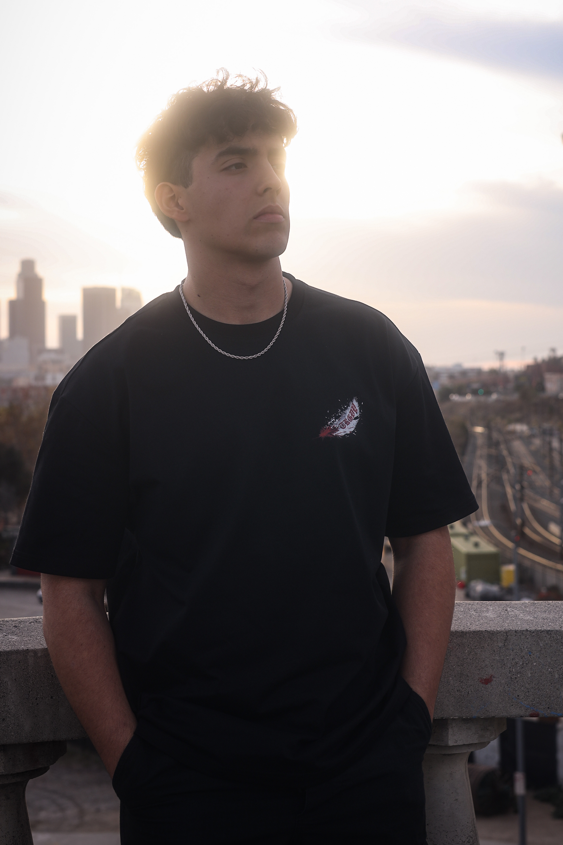 TRGDY “Too Close To The Sun” oversized tee, rear view, black baggy t-shirt with Icarus-inspired graphic, dark streetwear design